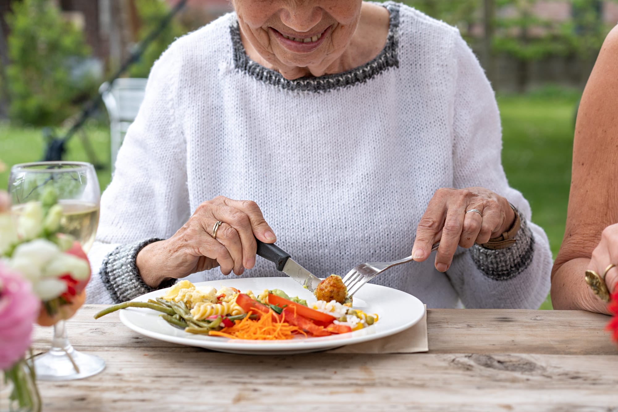 an older woman eating a healthy meal