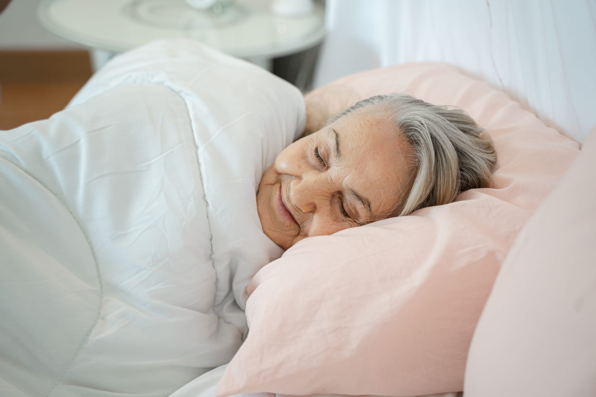 an elder lady who is having a delightful nap