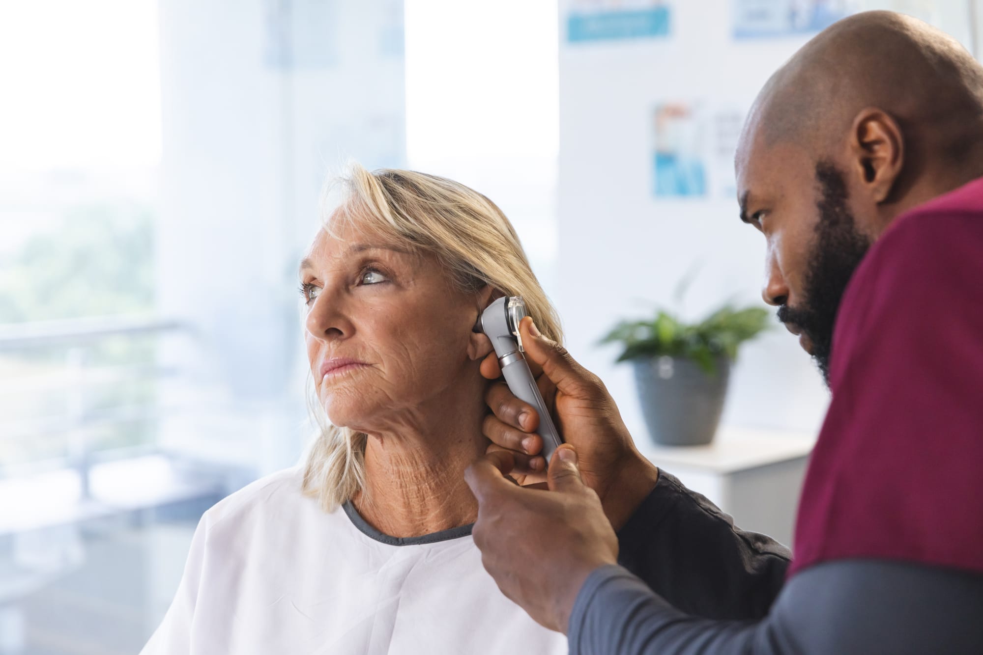 a woman getting a hearing test SeriousAging.com