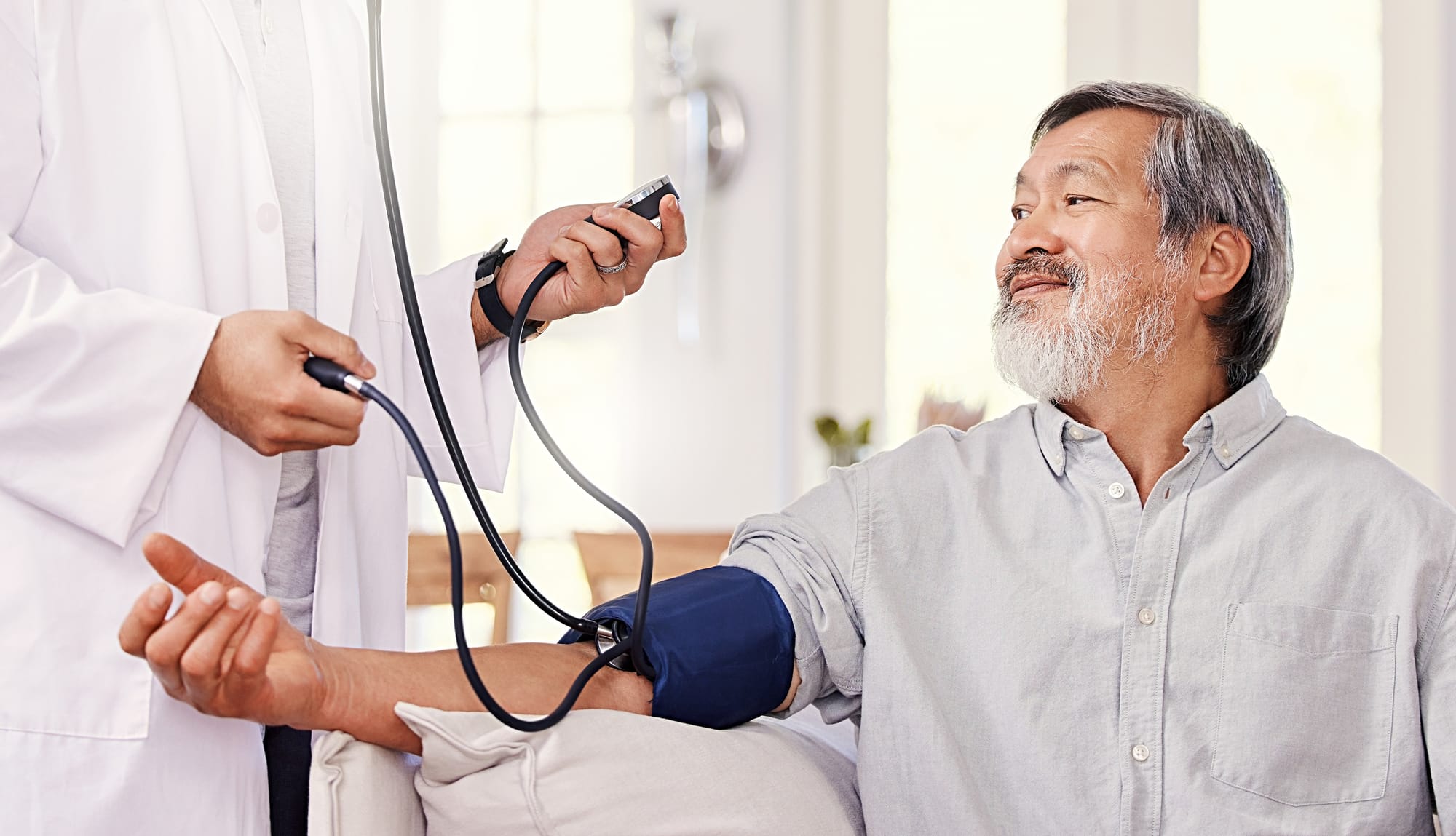 an older man getting his blood pressure checked