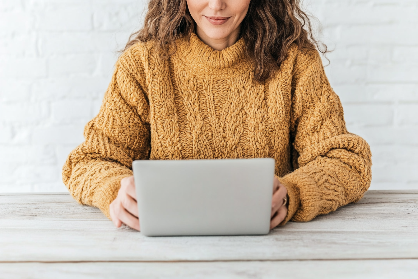 older woman writing a monthly newsletter