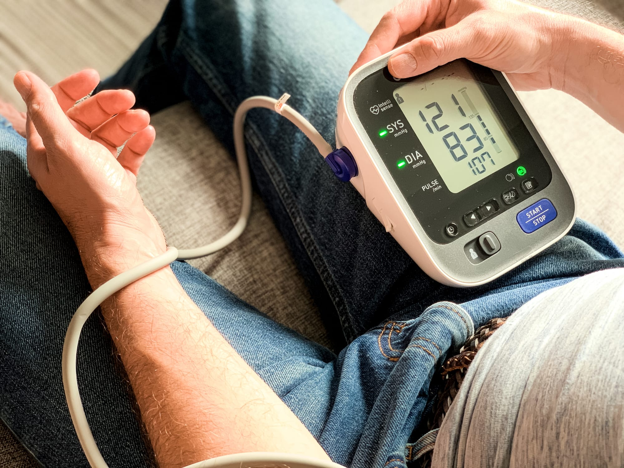 an older man checking his blood pressure - SeriousAging.com