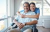 A family caregiver with her father sitting in a wheelchair