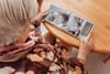 A woman with Dementia and Alzheimer's looking at memories from a long time ago