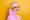 a fashionable older woman with purple glasses